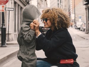 a black woman looking into her child's eyes